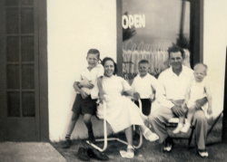 Teddy, Edna Baker Beyer, Billy, Henry Beyer, Philip Beyer-Front of Aunt Lovey's cleaners